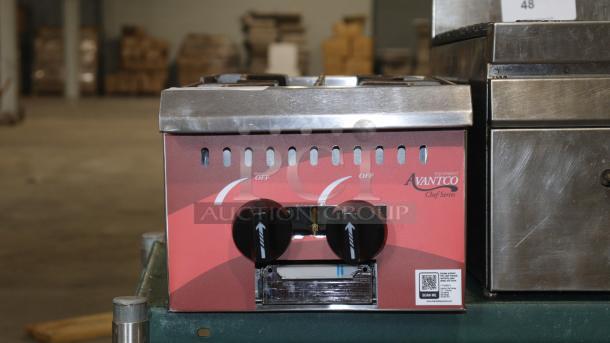 Brand new Avantco 177CAGR212 stainless steel 2-burner range, 50,000 BTU, natural gas, with slight scratches and dents.