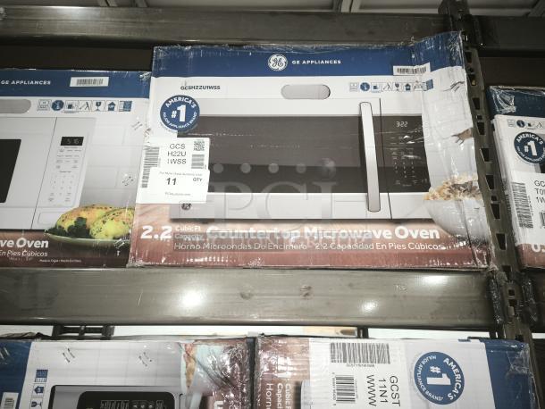 BRAND NEW GE® 2.2 Cu. Ft. Countertop Microwave, Model GCSH22U1WSS, in original packaging, minor scratches.