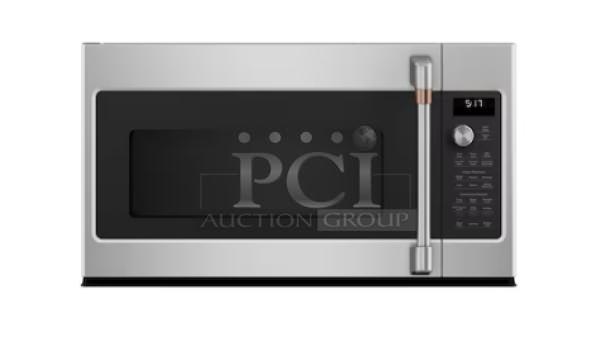 Brand new GE® 1.1 Cu. Ft. silver countertop microwave, model GCST11N1WSS, with minor scratches, pristine condition.