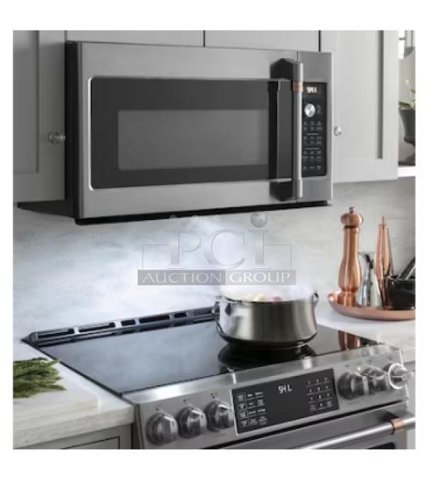 Brand new GE 1.1 Cu. Ft. silver countertop microwave oven, model GCST11N1WSS, with minor scratches and dents.