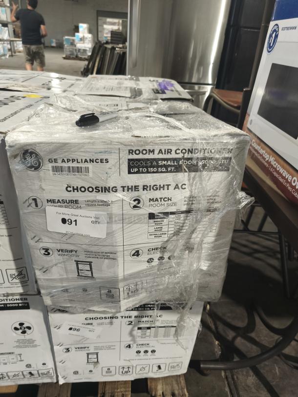 BRAND NEW SCRATCH AND DENT GE® 5,000 BTU Window Air Conditioner, Model AWFS05BWL, in original packaging with some wrapping intact.
