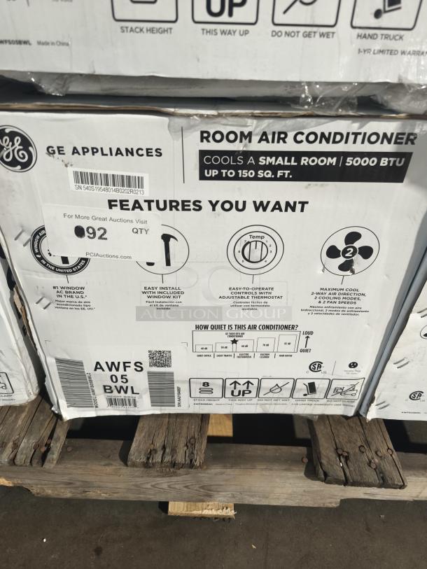 BRAND NEW GE 5,000 BTU mechanical window AC, model AWFS05BWL. Box shows features and cooling capacity for up to 150 sq. ft.