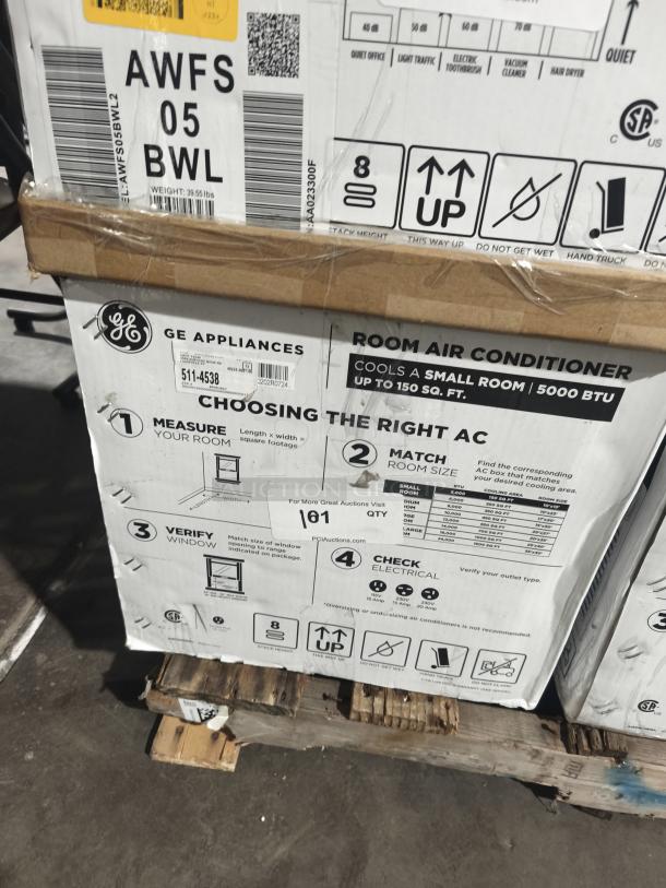 Brand new GE 5,000 BTU mechanical window air conditioner, model AWFS05BWL. Box shows handling instructions and cooling info.