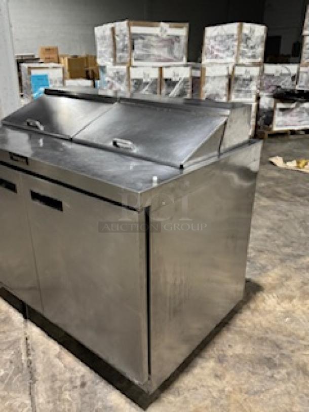 Delfield 4464NP-16 refrigerated sandwich prep table, 64", two doors, stainless steel, front breathing, with 3" casters.
