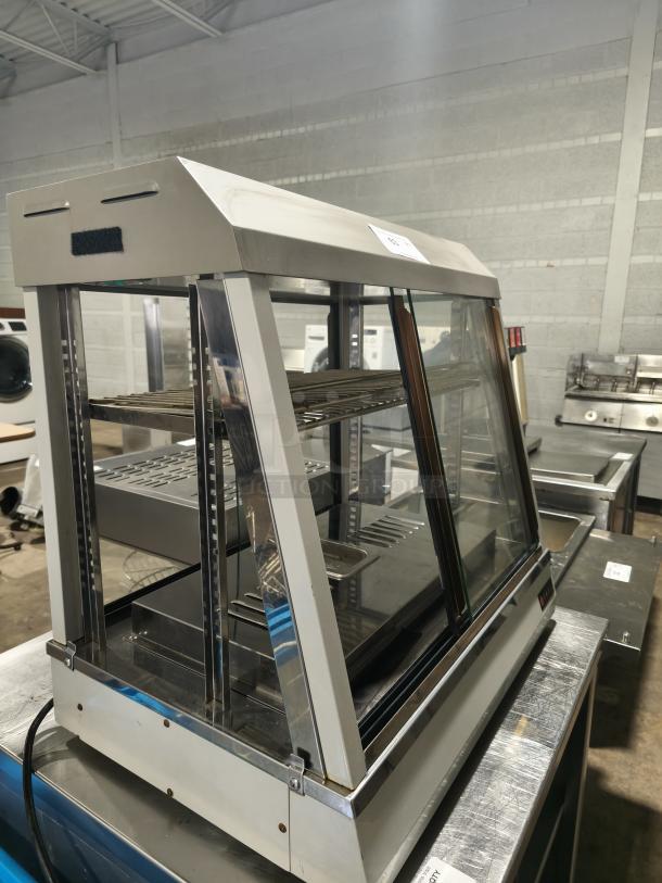 Anvil Hot Curved Countertop Display Cabinet, Model DGH0540, missing glass, tested and working, stainless steel, interior shelves visible.
