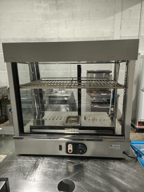 Anvil DGH0540 hot curved countertop display cabinet, missing glass, tested and working, with temperature controls, stainless steel.