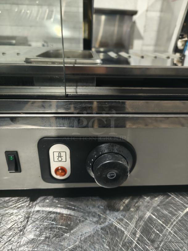 Anvil DGH0540 hot curved countertop display cabinet, tested, missing glass, visible controls and temperature settings.