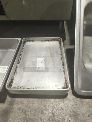 Commercial heavy-duty aluminum half-sheet pan, used condition, visible signs of wear and rust, quantity label showing "QTY 5".