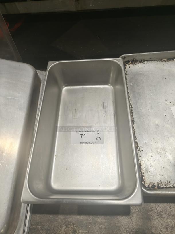 Commercial stainless steel 1/3 size hotel pan, good condition, auction tag indicates quantity 3, lot number 71.