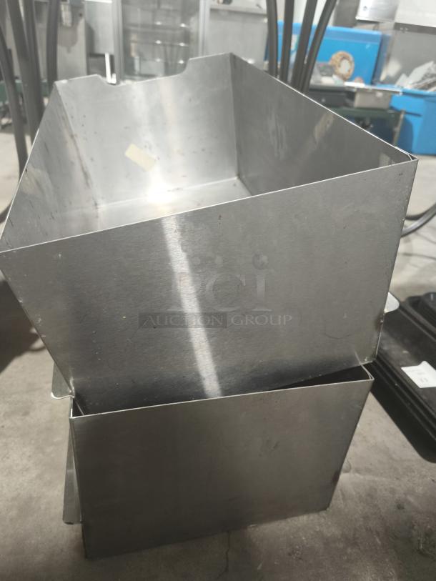 Stainless steel commercial bus tub, rectangular shape, lightly used, durable utility bin with smooth surfaces and open top.