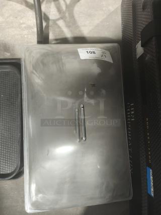 Clear acrylic buffet display dome with handle, slightly scratched surface, auction label 108 visible.