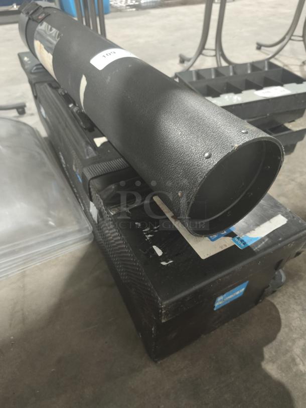 Adjustable black poster/blueprint carrying tube with strap, textured surface, and visible white label. Good condition.