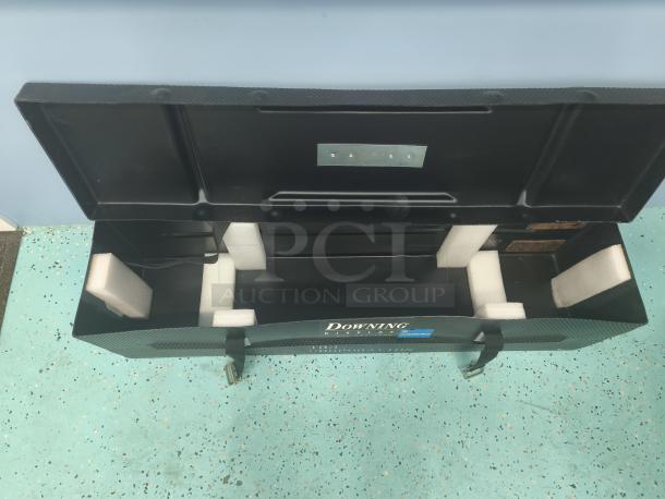 Downing Displays hard-sided trade show shipping/display case with foam padding, sturdy construction, and secure latches.