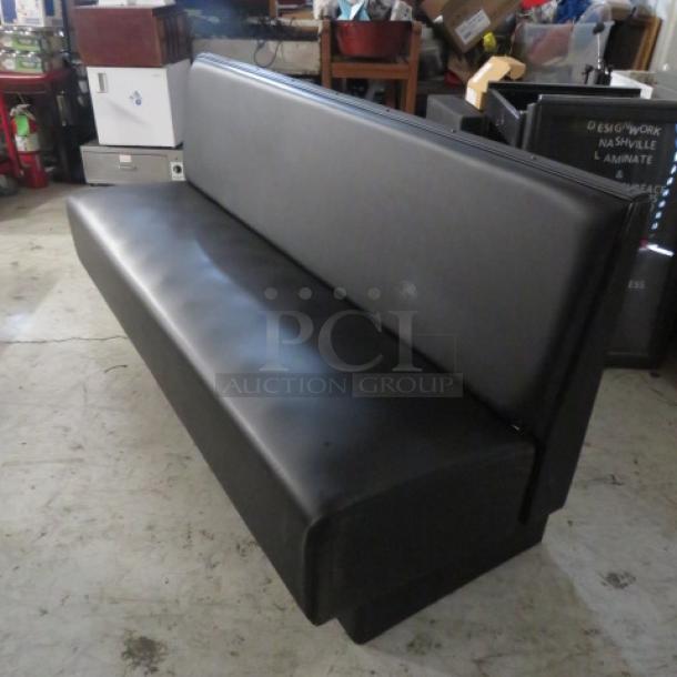 Black cushioned booth/waiting bench, single-sided, excellent condition, 81"x27"x36".