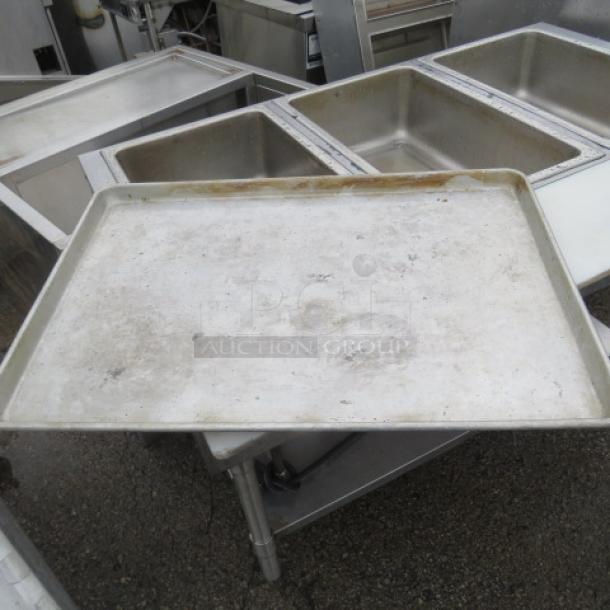 Full-size sheet pan, used condition, metal surface with visible wear. Ideal for baking, catering, or kitchen use.