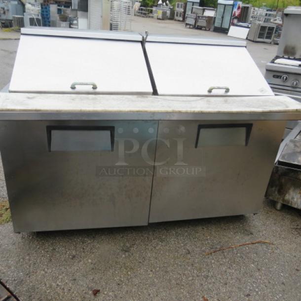 True 2-door refrigerated prep table with cutting board, model TSSU-60-24M-B-ST, 60x34x45, on casters, includes 1 rack.