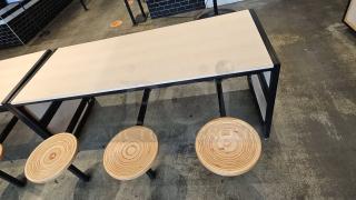 Wooden/metal table with six attached round wooden stools, 75x30x30. Modern design, excellent condition, natural wood finish.