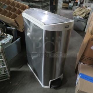 Rubbermaid XL stainless steel trash can, 13.5x26x33 inches, good condition, foot pedal, and lid.