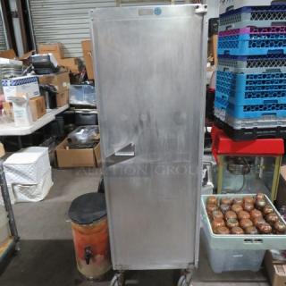 Epco aluminum holding cabinet on casters, 21x27x63 inches, shows minor wear in an industrial setting.