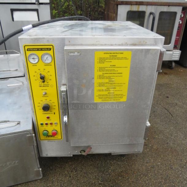 Accutemp Steam and Hold oven, Model 208D6-300, 208V, 23x26x30. Features control panel and operating instructions. Good condition.