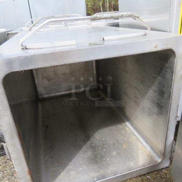 Vollrath stainless steel insulated catering food transport box, model 22019, with handles. Measures 14x27x14 inches.