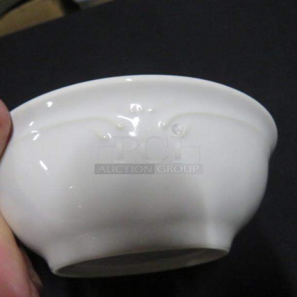 6-inch white Pfaltzgraff bowl, gently used, with embossed design near the rim. Model 12XBID.