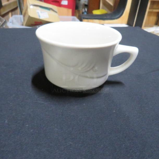 Sysco white coffee cup with subtle swirl design, excellent condition, standard size, durable ceramic material.
