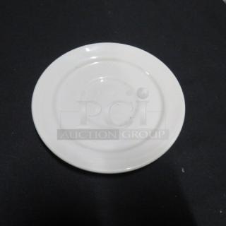 5.5-inch white Sysco saucer, lightly used condition, circular groove design, suitable for dining settings.