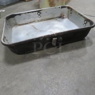 Vintage metal roasting pan, rectangular, distressed exterior, white enamel interior, worn condition, metal handles.