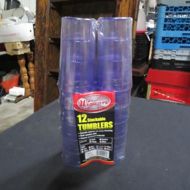 Set of 12 new Winware 12oz stackable tumblers in clear plastic packaging. Ideal for easy storage and cleaning.