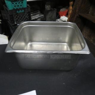 Half-size 6-inch hotel pan, stainless steel, smooth finish, in good condition. Suitable for commercial kitchen use.