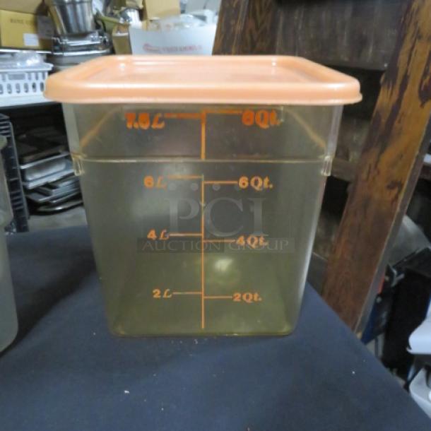 8 Quart food storage container with lid, marked increments, clear plastic, square shape, orange lid, used condition.