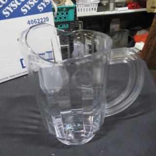 NEW Sysco 60oz clear poly pitcher. Features sturdy handle, spout. Excellent condition. Includes Sysco box visible.