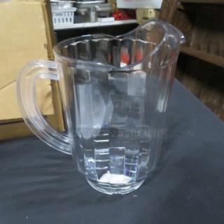 NEW Carlisle 60oz clear polycarbonate pitcher, with ergonomic handle and pour spout; condition: excellent, unused.