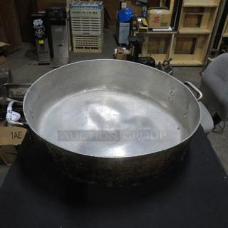 19-inch aluminum braising pan, used condition, sturdy handles, slight wear marks. Ideal for large-scale cooking tasks.