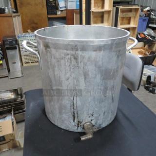 Aluminum stock pot with drain, 14x15.5 inches, used condition, visible wear; ideal for large-capacity cooking needs.