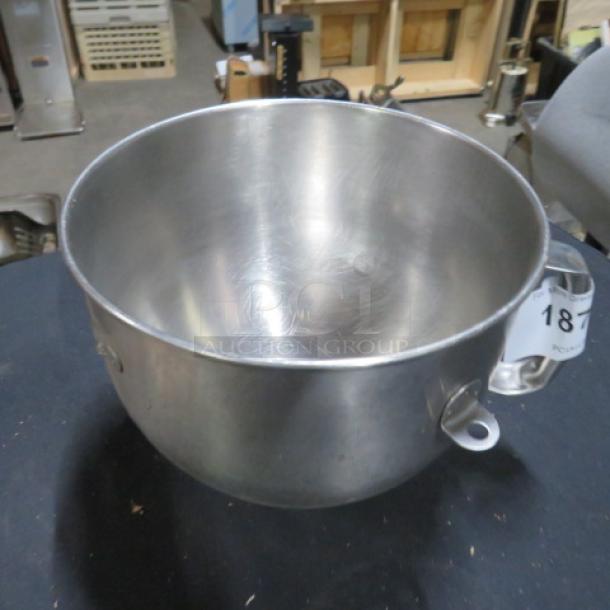 Stainless steel mixer bowl with handle, lightly used condition, visible minor scratches, auction tag number 18 attached.