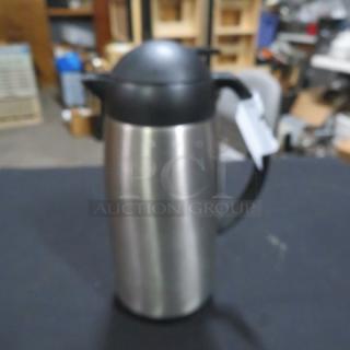Adcraft creamer, stainless steel, black plastic handle and lid, good condition, suitable for hot and cold beverages.