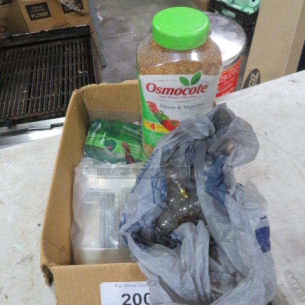 Box with Osmocote plant food, garden supplies, and miscellaneous items. Condition appears used.