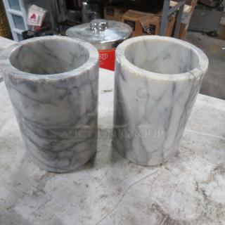 Pair of heavy marble wine bottle holders with a natural gray veined pattern. In good condition.
