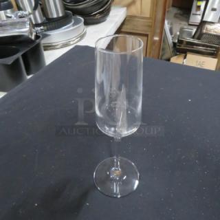Clear stem wine glass, new condition, no visible marks or labels, sleek modern design.