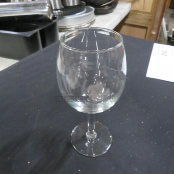 Clear stem wine glass, new condition, round bowl, smooth surface, ideal for wine enthusiasts, labeled 10XBID.