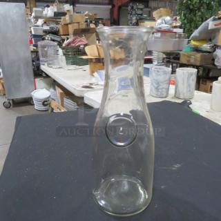 Clear 1-liter glass carafe, model 8XBID, in good condition. Simple design with round grooved detail.