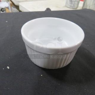 White 3.5-inch ramekin with ribbed sides, ideal for baking or serving. Excellent condition, no visible markings.