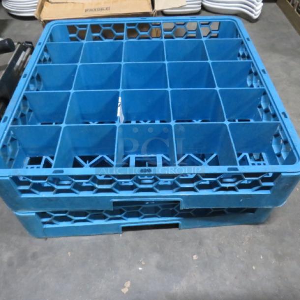 Blue 25-hole dishwasher rack, durable plastic, stackable design. Visible marking: "2XBID". Excellent condition.