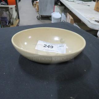 8.5x6.5 Evolution Dutch Beige Bowl, excellent condition, smooth finish, auction label with item number 249.
