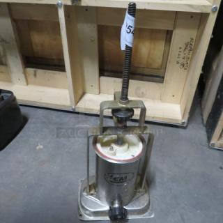 LEM sausage stuffer in used condition. Features a metal base, vertical mechanism, and LEM logo on the front.