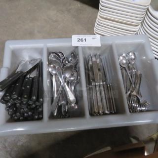 Gray flatware holder with assorted flatware including knives, forks, and spoons; auction label reads "261."