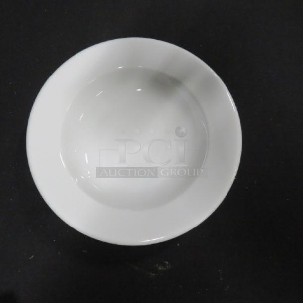 White 9-inch ceramic bowl, smooth finish, like new condition, no visible markings, ideal for serving or display.