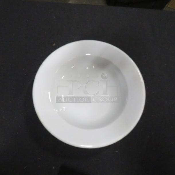New 9-inch white bowl, model 7XBID, in pristine condition. Smooth finish, ideal for serving or display.